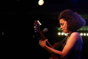 Anoushka Lucas playing the guitar