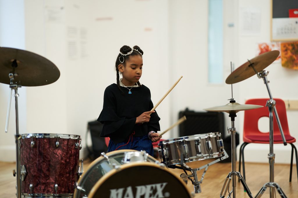 Student playing the drums